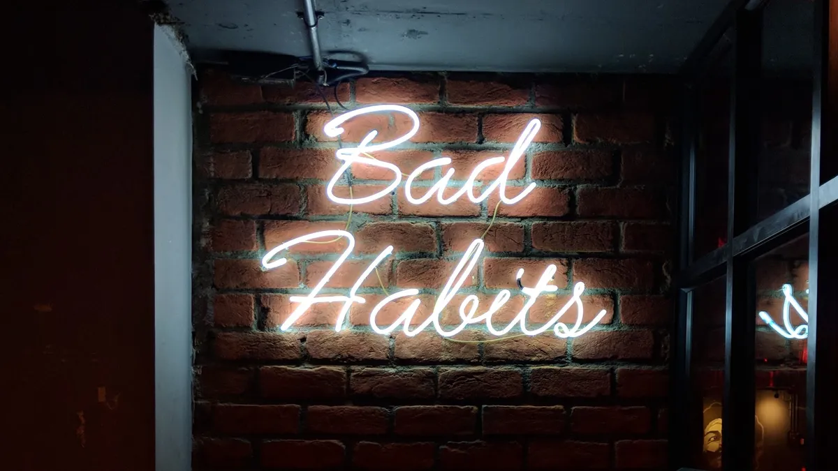 Bad habits neon sign