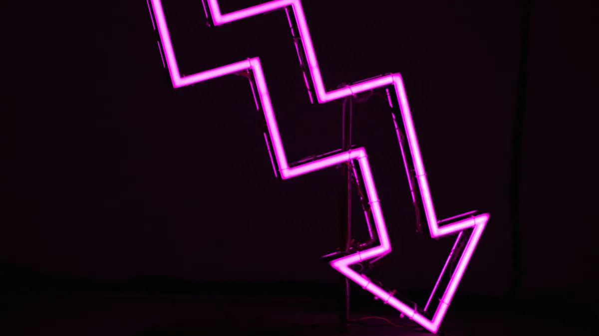 Downward arrow neon sign