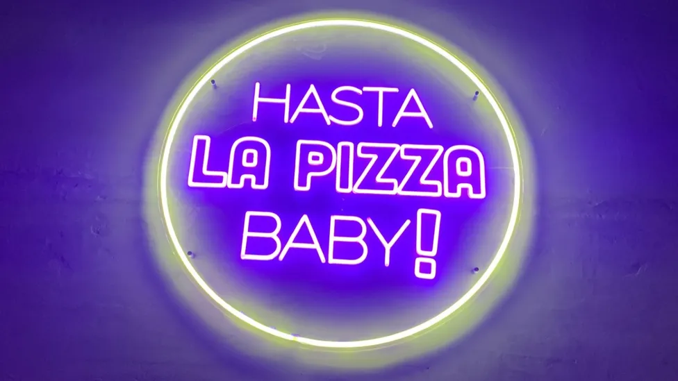 Hasta Pizza neon sign