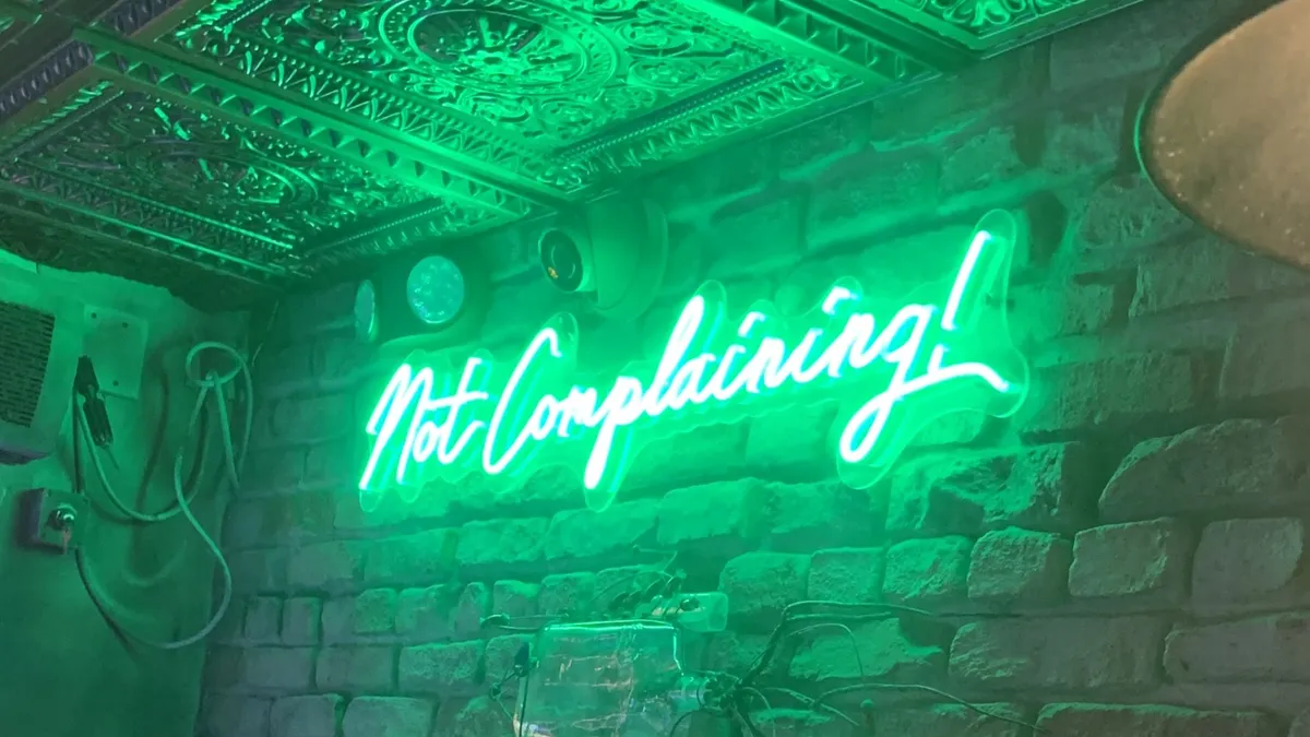 Not complaining neon sign