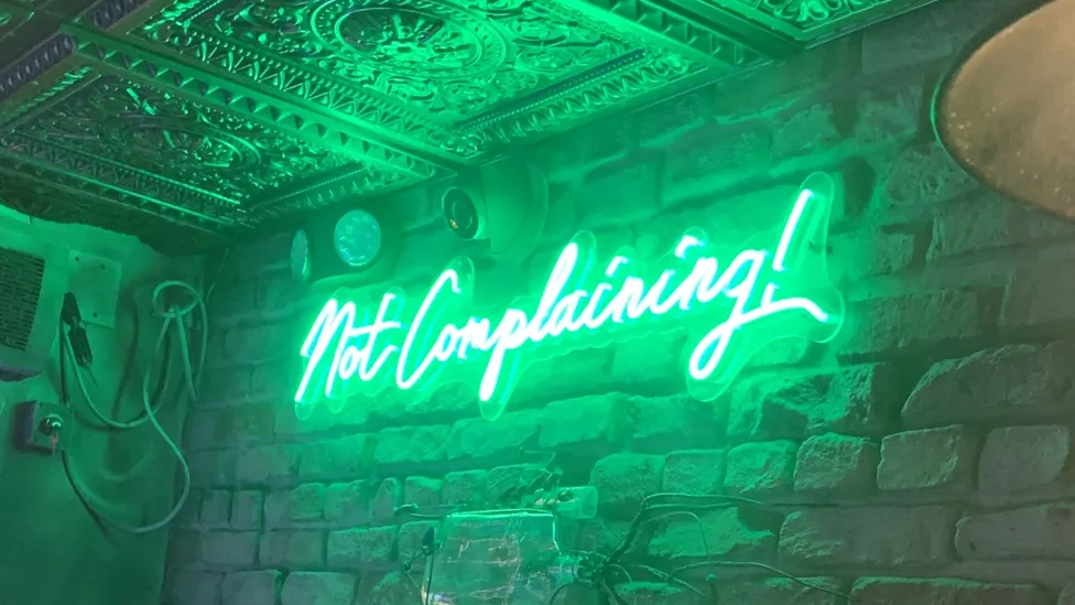 Not complaining neon sign